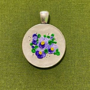 Hand sculpted violet clay necklace.